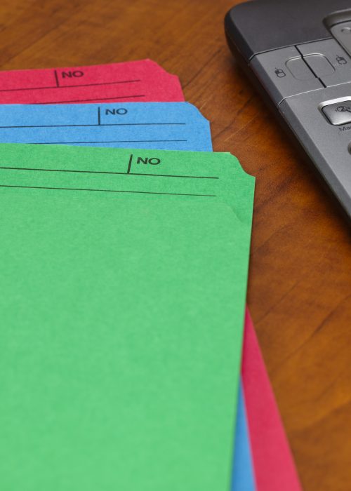 colorful-files-and-glasses-on-a-wooden-desk-2026-03-26-06-40-18-utc